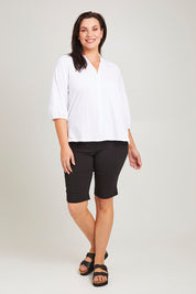 Model Poppy wearing size 16 of the Prue Tee in colour White (White), from the front, showing the whole outfit