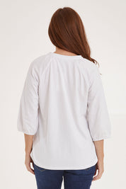 Model Sally wearing size 10 of the Prue Tee in colour White (White), from the back