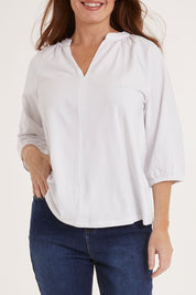 Model Sally wearing size 10 of the Prue Tee in colour White (White), from the front, cropped image