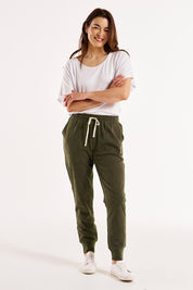 A model wearing the Bondi Cotton Jogger in colour Huskgreen (Green), from the front, showing the whole outfit