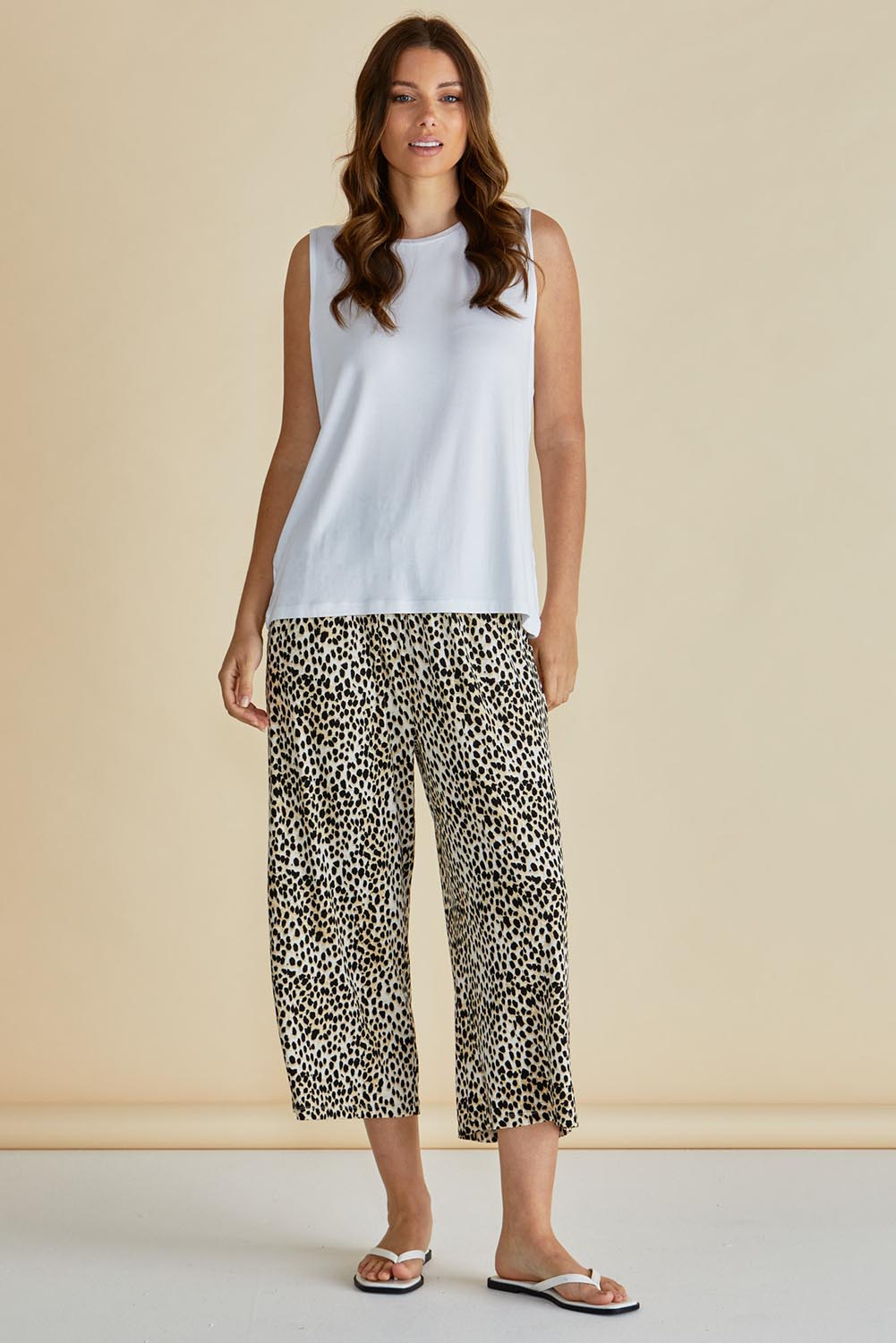 A model wearing the Crystal Bamboo Crop Jogger in colour Cheetah, from the front, showing the whole outfit