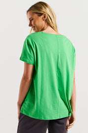 A model wearing the Teagan Cotton Vin colourNeck Tee - Surfbeach (Green), from the back