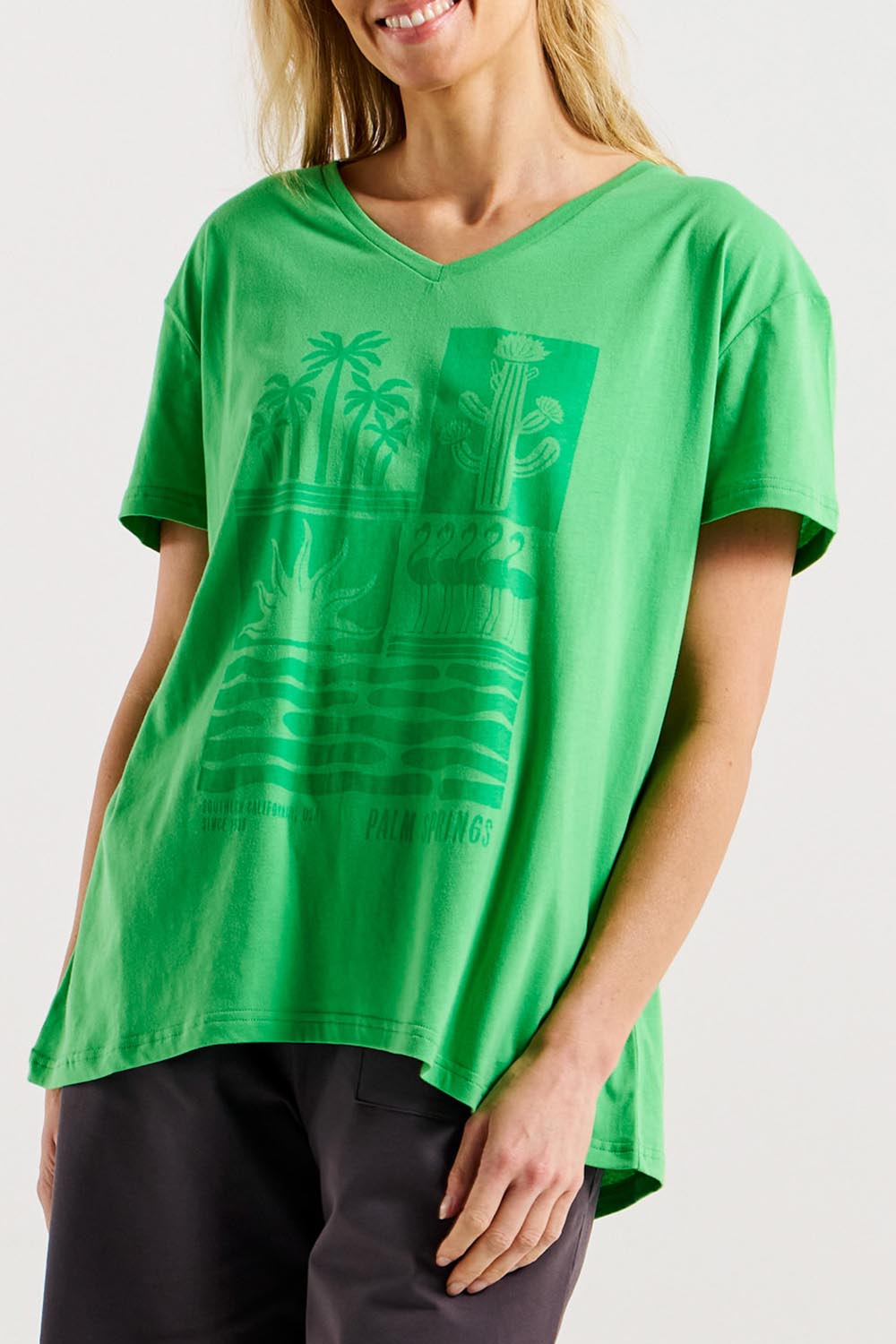 A model wearing the Teagan Cotton Vin colourNeck Tee - Surfbeach (Green), from the front, cropped image