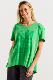 A model wearing the Teagan Cotton Vin colourNeck Tee - Surfbeach (Green), from the front, cropped image