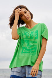A model wearing the Teagan Cotton Vin colourNeck Tee - Surfbeach (Green), from the front, showing the whole outfit