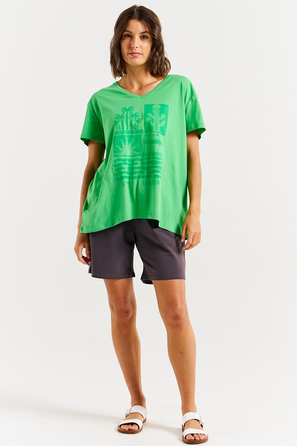 A model wearing the Teagan Cotton Vin colourNeck Tee - Surfbeach (Green), from the front, showing the whole outfit