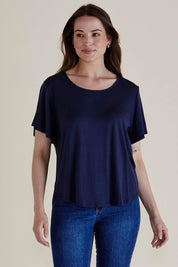 A model wearing the Everleigh Bamboo Tee in colour Navy (Blue), from the front, cropped image