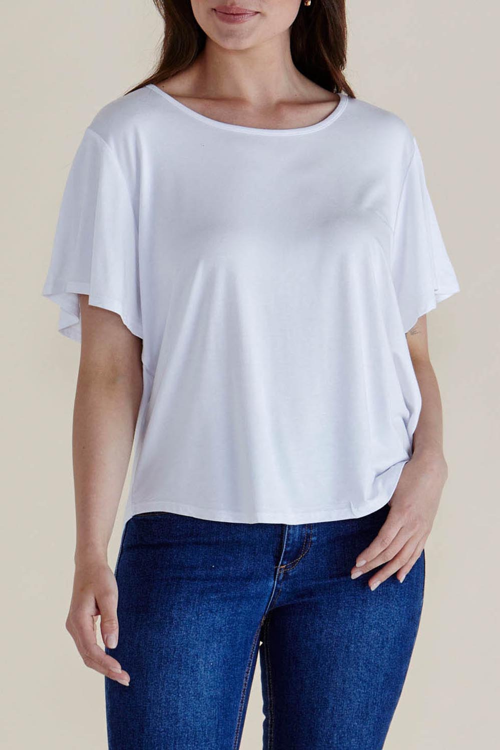 A model wearing the Everleigh Bamboo Tee in colour White (White), from the front, cropped image