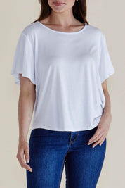 A model wearing the Everleigh Bamboo Tee in colour White (White), from the front, cropped image