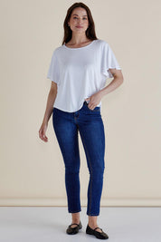 A model wearing the Everleigh Bamboo Tee in colour White (White), from the front, showing the whole outfit