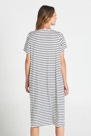 A model wearing the Irena Bamboo Tin colourShirt Dress - Navystripe (Blue), from the back