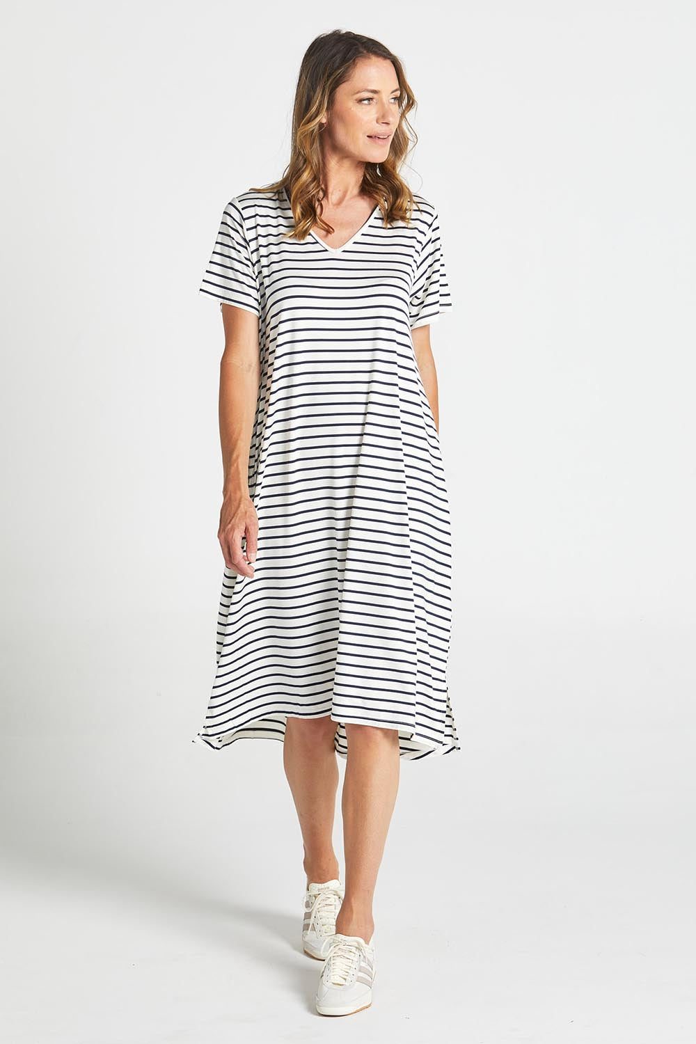 A model wearing the Irena Bamboo Tin colourShirt Dress - Navystripe (Blue), from the front, showing the whole outfit