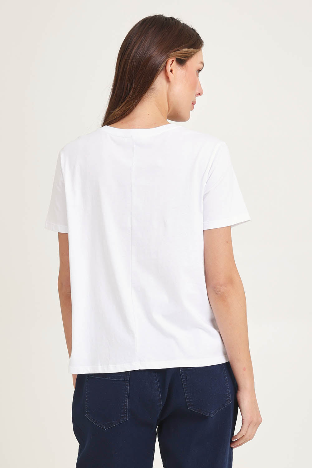 Model Madeline wearing size 10 of the Ellia Cotton Crew Tee in colour Floral (White), from the back