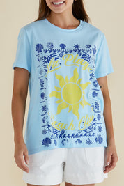A model wearing the Ellia Cotton Crew Tee in colour Laplage (Blue), from the front, cropped image