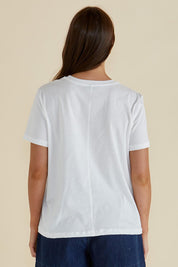 A model wearing the Ellia Cotton Crew Tee in colour Paradise (White), from the back