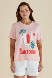 A model wearing the Ellia Cotton Crew Tee in colour Santorini (Pink), from the front, cropped image