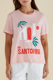A model wearing the Ellia Cotton Crew Tee in colour Santorini (Pink), from the front, cropped image