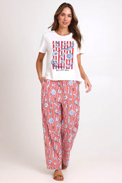 Model Madelinec wearing size 10 of the Ellia Crew Tee – Sunsea in colour Sunsea, from the front