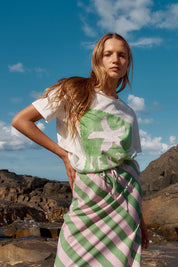 A model wearing the Ellia Cotton Crew Tee in colour Verao (Green), from the front, showing the whole outfit