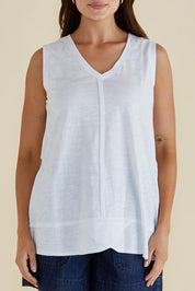 A model wearing the Mariah Cotton Tank in colour White (White), from the front, cropped image