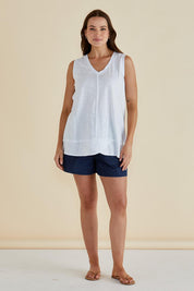 A model wearing the Mariah Cotton Tank in colour White (White), from the front, showing the whole outfit