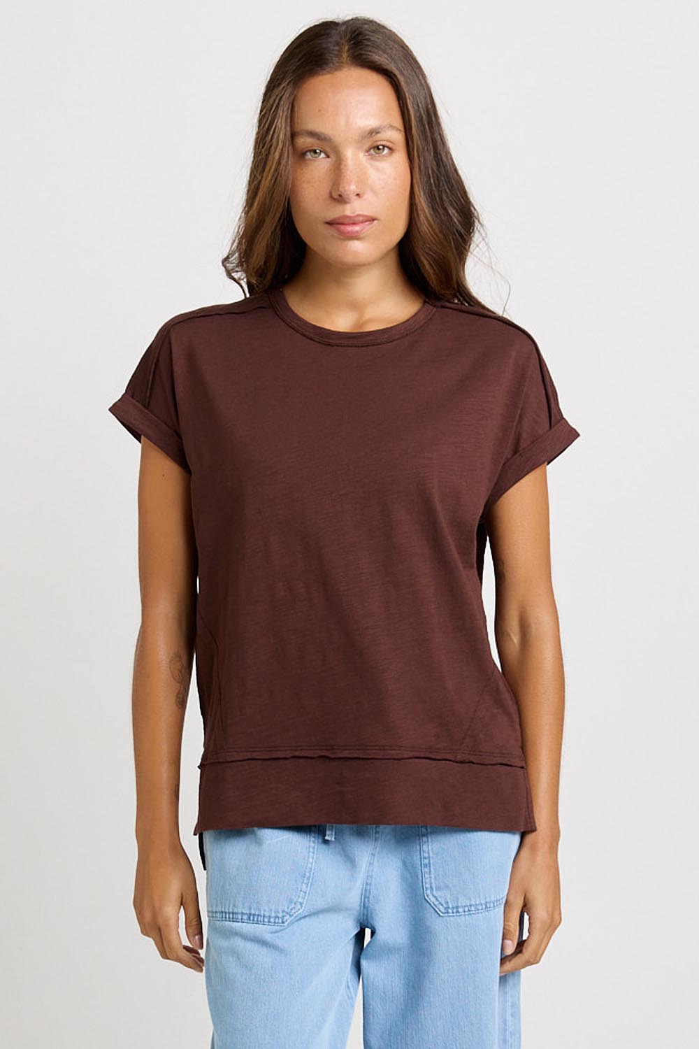 Model Genericm wearing size sample of the Shirley Short Sleeve Tee – Chocolate in colour Chocolate, in a cropped view