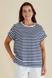 A model wearing the Shirley Cotton Short Sleeve Tee in colour Navystripe (Blue), from the front, cropped image