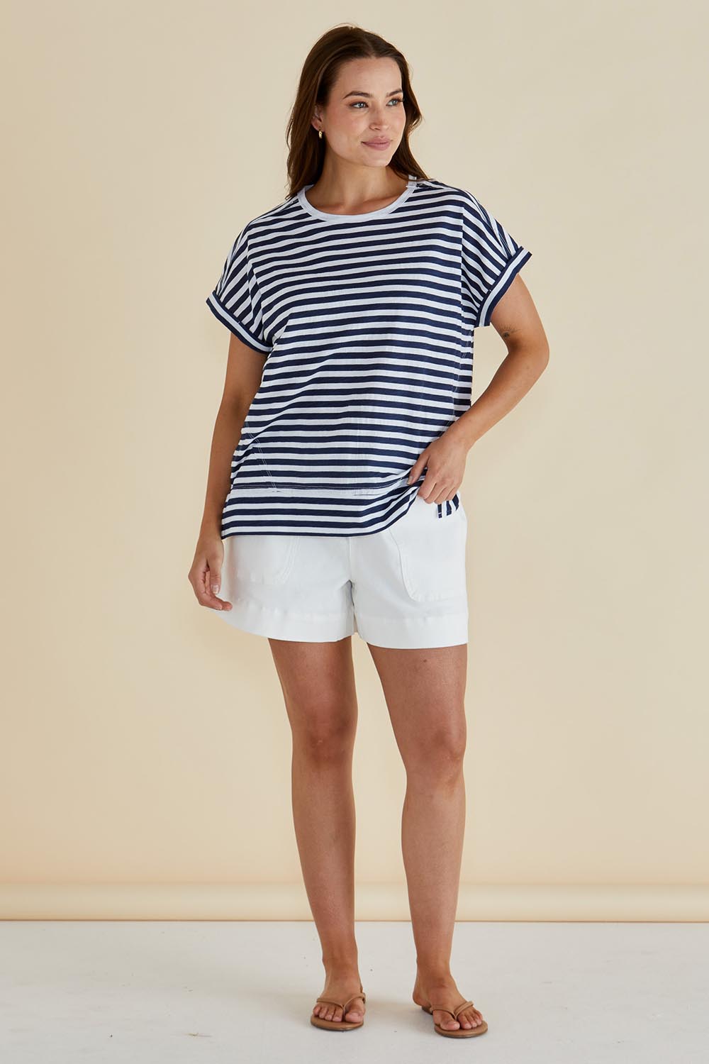 A model wearing the Shirley Cotton Short Sleeve Tee in colour Navystripe (Blue), from the front, showing the whole outfit