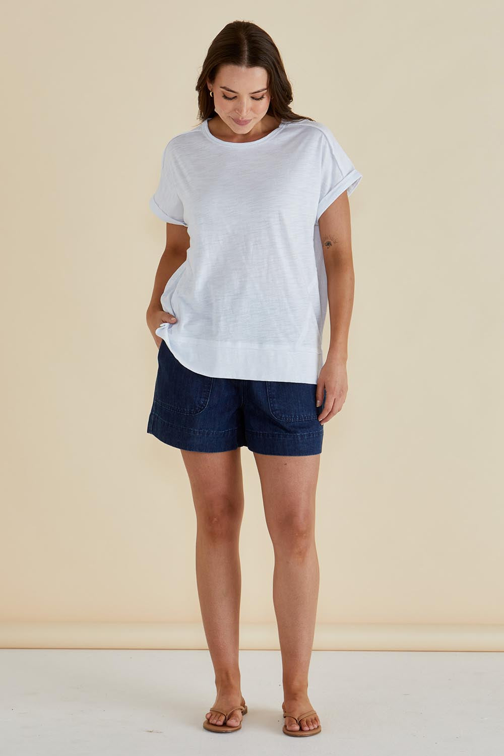 A model wearing the Shirley Cotton Short Sleeve Tee in colour White (White), from the front, showing the whole outfit