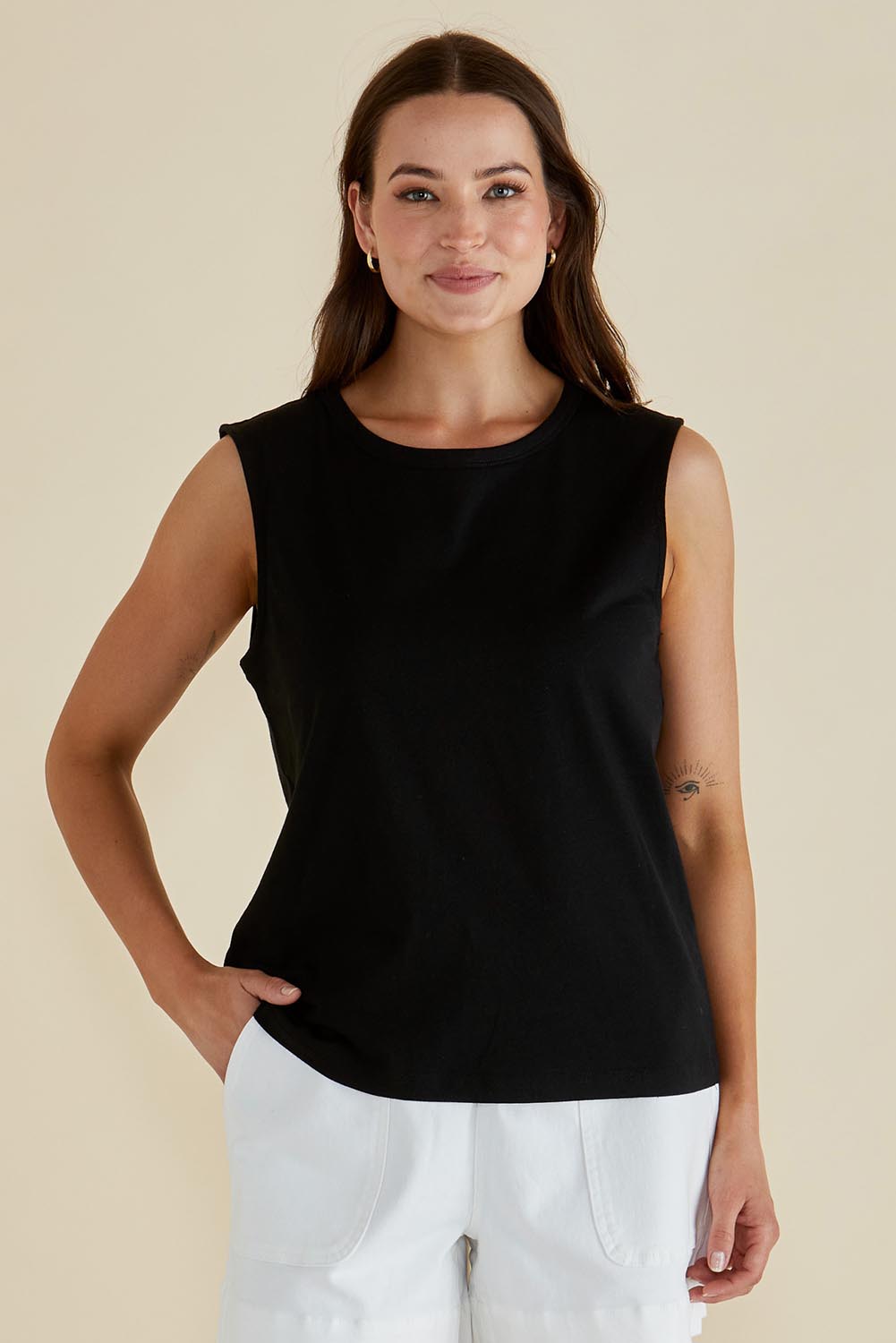 A model wearing the Jordyn Cotton Tank in colour Black (Black), from the front, cropped image