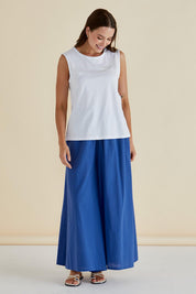 A model wearing the Jordyn Cotton Tank in colour White (White), from the front, showing the whole outfit