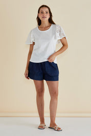 A model wearing the Lottie Embroidered Cotton Tee in colour White (White), from the front, showing the whole outfit