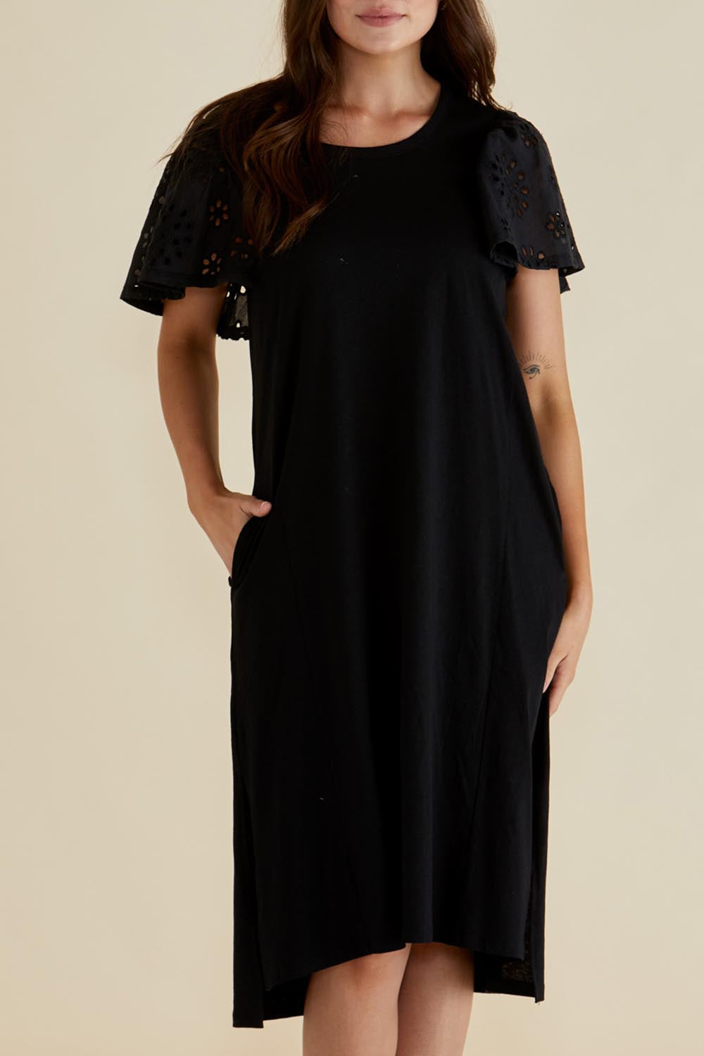 A model wearing the Sawyer Embroidered Cotton Dress in colour Black (Black), from the front, cropped image