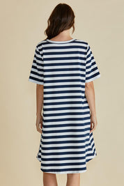 A model wearing the Eloise Cotton Tin colourShirt Dress - Navy (Blue), from the back