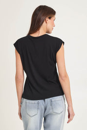 Model Madeline wearing size 10 of the Cuff Cotton Blend Rib Tee in colour Black (Black), from the back