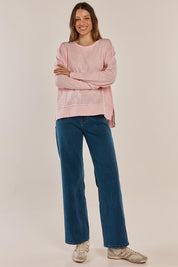 A model wearing the Beatris Tee in colour Pink (Pink), from the front, showing the whole outfit