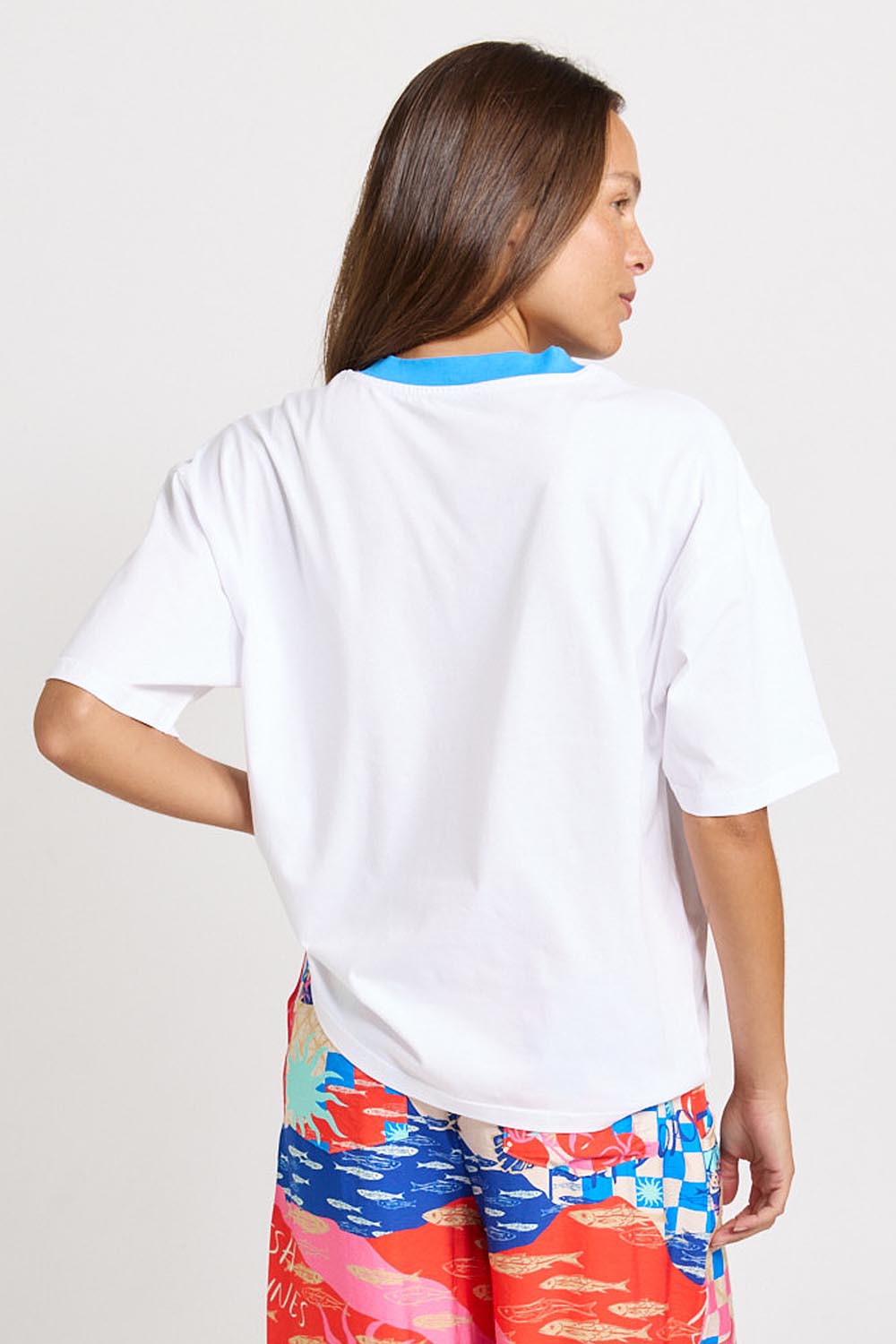 Model Genericm wearing size sample of the V-Neck Boxy Tee – Paradise in colour Paradise, from the back