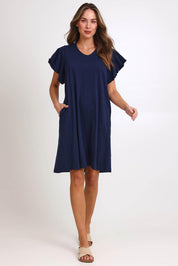 Model Madelinec wearing size 10 of the Celene Frill Dress – Navy in colour Navy, from the front