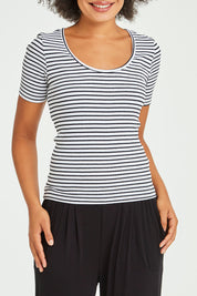 Model Olivia wearing size 10 of the Stacey Rib Tee in colour Whiteblack (White), from the front, cropped image
