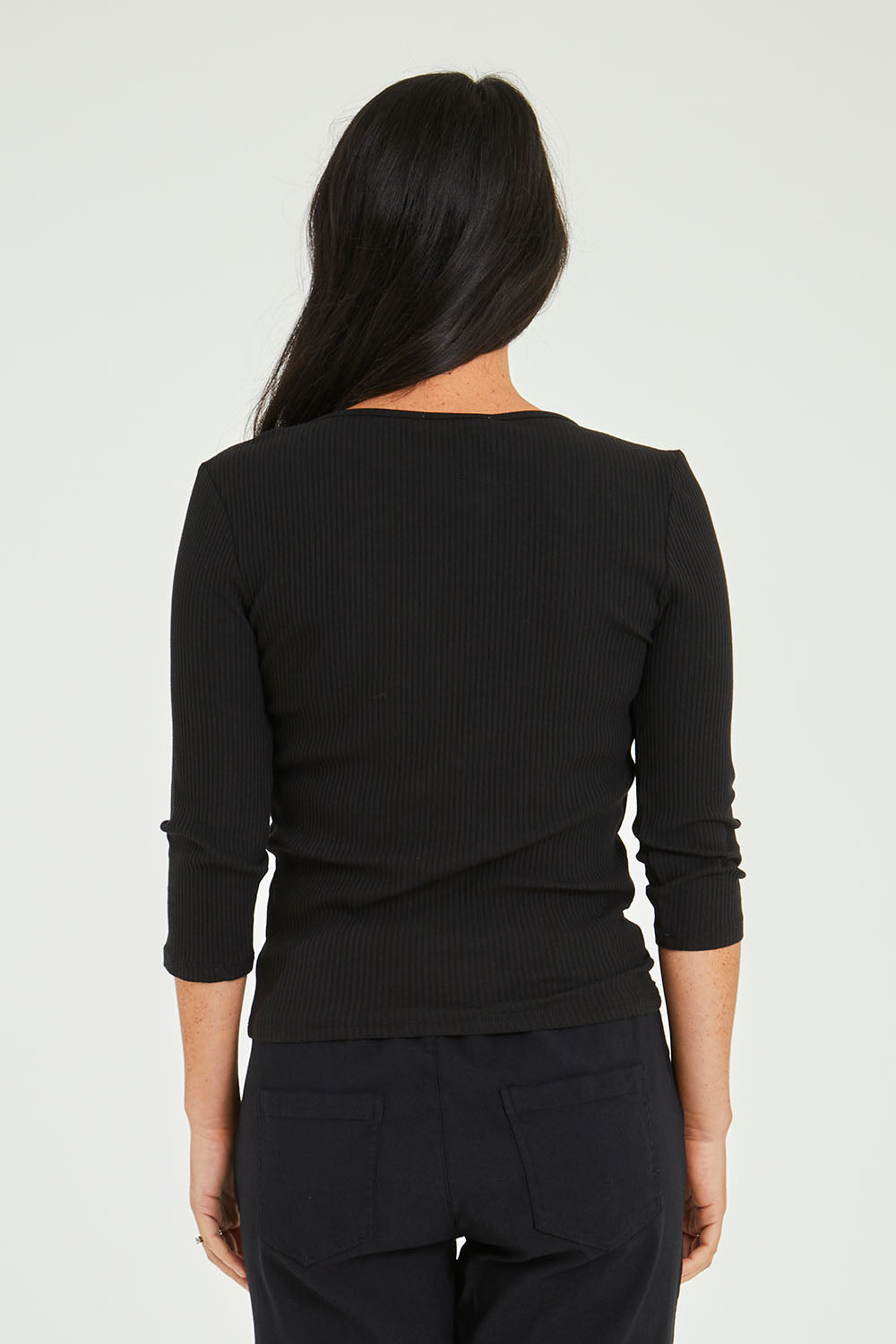 Model Katie wearing size 10 of the Rosa 3/4 Rib Top in colour Black (Black), from the back