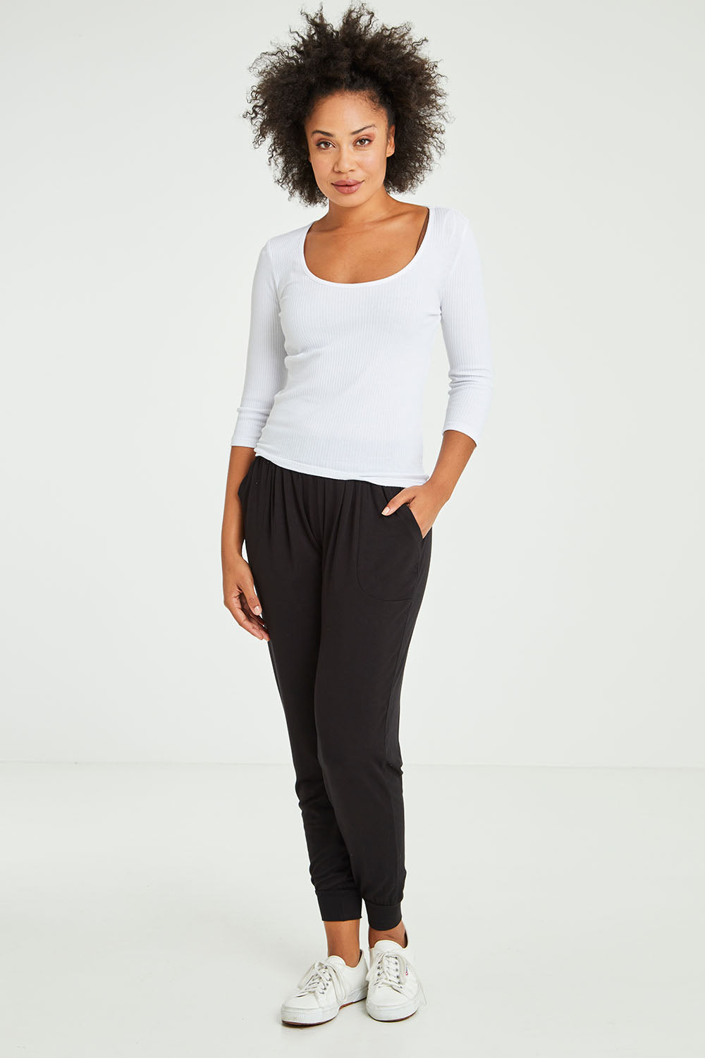 Model Olivia wearing size 10 of the Rosa 3/4 Rib Top in colour White (White), from the front, showing the whole outfit