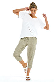 A model wearing the Burleigh Tee in colour White (White), from the front, showing the whole outfit
