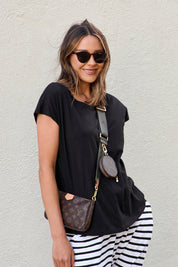 A model wearing the Tyra Top in colour Black (Black), from the front, showing the whole outfit
