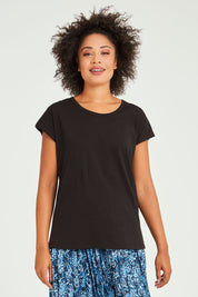 Model Olivia wearing size 10 of the Tyra Top in colour Black (Black), from the front, cropped image