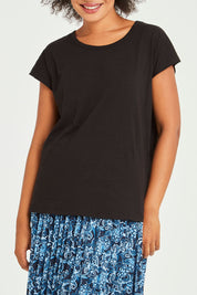 Model Olivia wearing size 10 of the Tyra Top in colour Black (Black), from the front, cropped image