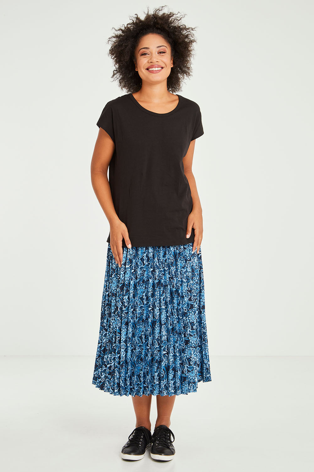 Model Olivia wearing size 10 of the Tyra Top in colour Black (Black), from the front, showing the whole outfit