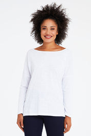 Model Olivia wearing size 10 of the Monique Top in colour White (White), from the front, cropped image