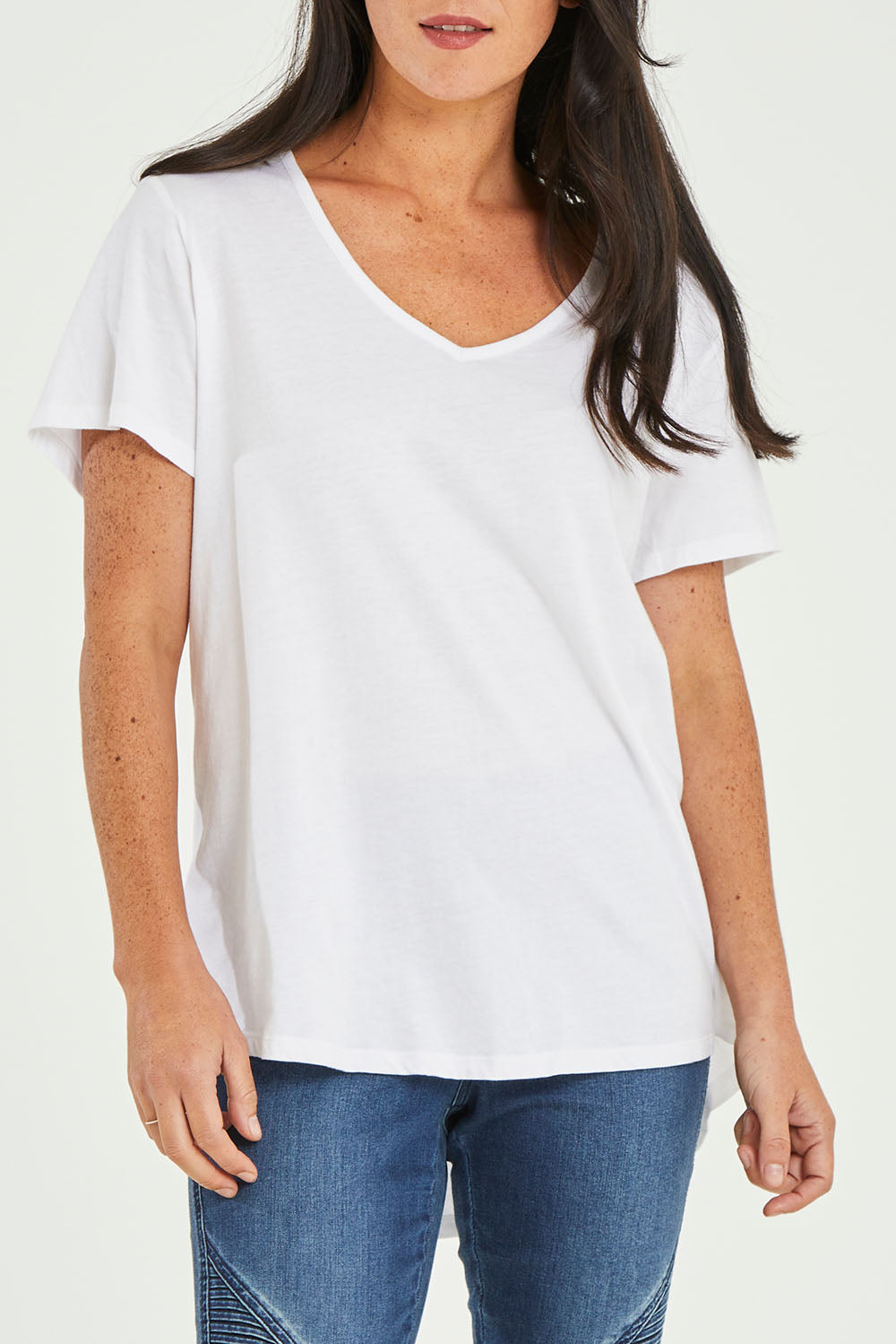 Model Katie wearing size 10 of the Ava Tee in colour White (White), from the front, cropped image