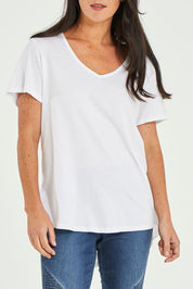 Model Katie wearing size 10 of the Ava Tee in colour White (White), from the front, cropped image