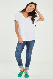 Model Katie wearing size 10 of the Ava Tee in colour White (White), from the front, showing the whole outfit